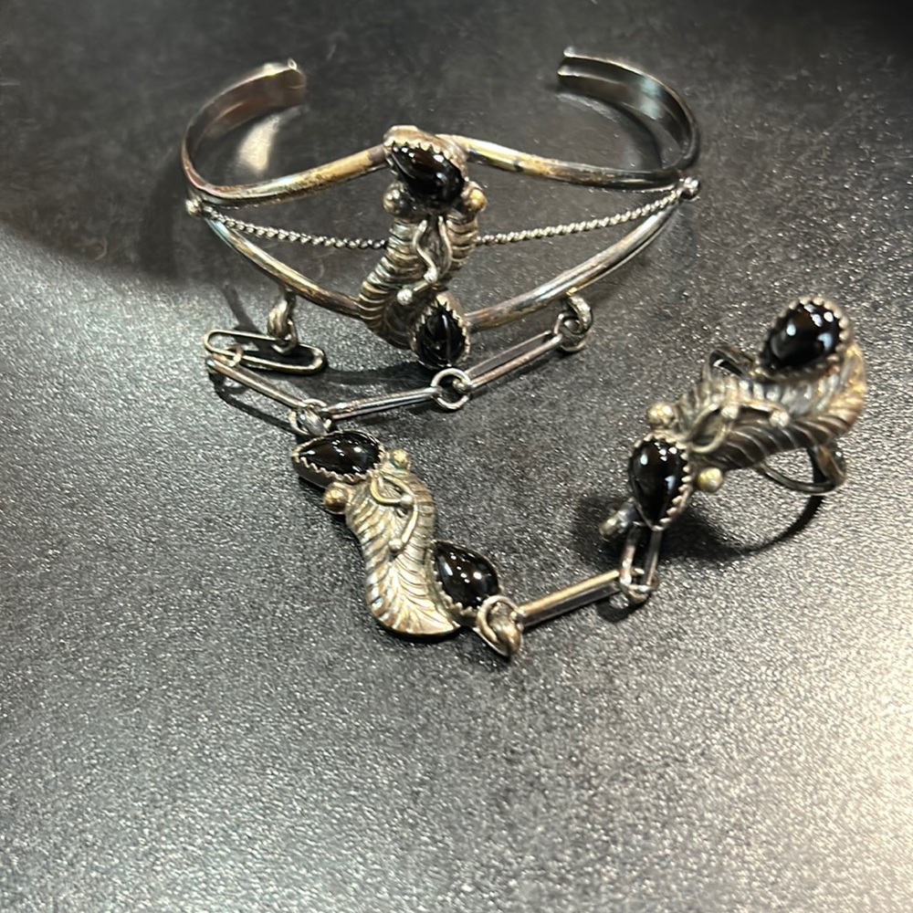Selling for a friend.. needs a good cleaning..cuff attachment to ring .